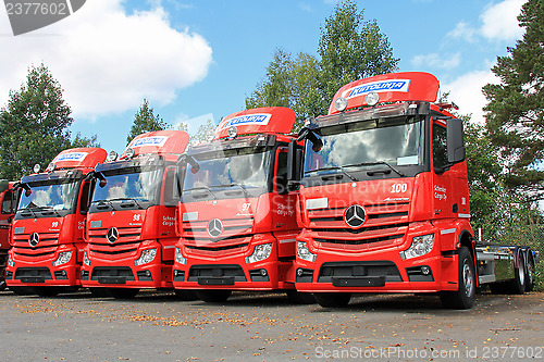 Image of Four Red Mercedes-Benz Actros Trucks