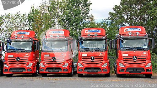 Image of Row of Red Mercedes-Benz Actros Trucks