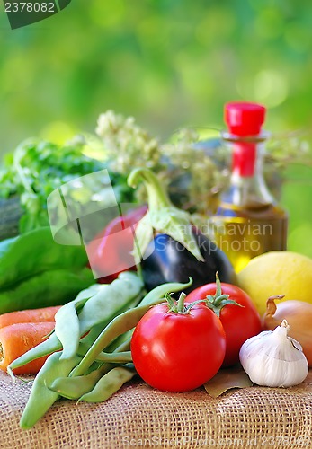 Image of Fresh vegetables , olive oil and spices