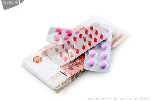 Image of Pills and money