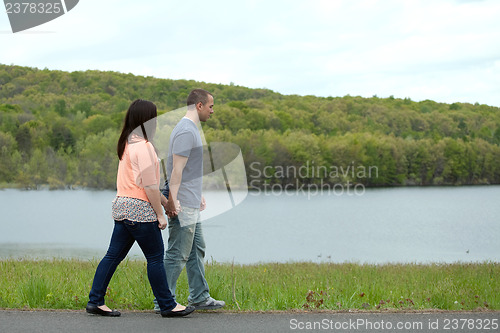Image of Young Couple Walking Together