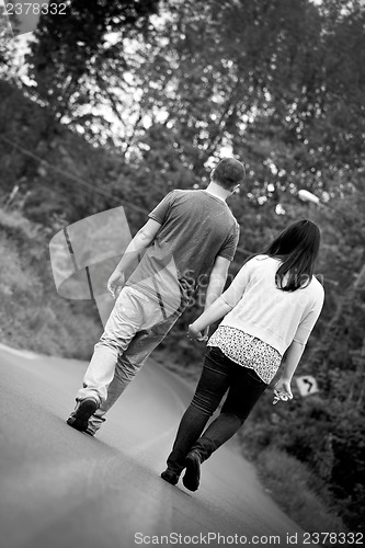 Image of Couple Walking Down the Street