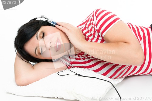 Image of Woman resting with favourite music