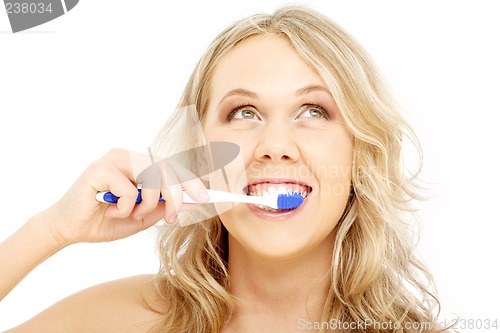 Image of happy blond with toothbrush