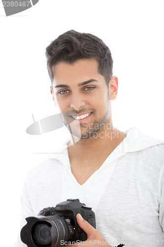 Image of Young man with a dslr camera in his hands