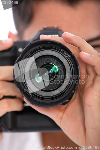 Image of Man focusing his camera
