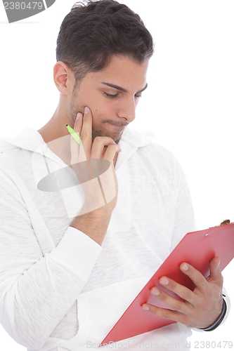 Image of Young man reading notes on a clipboard