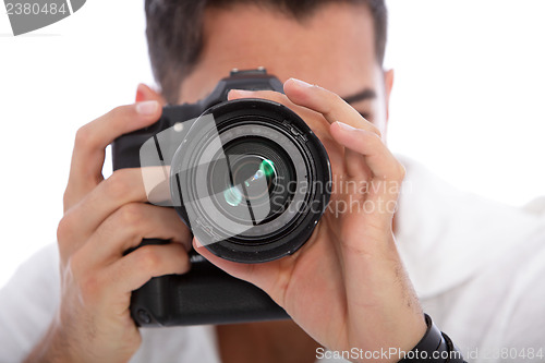 Image of Male photographer taking a photograph