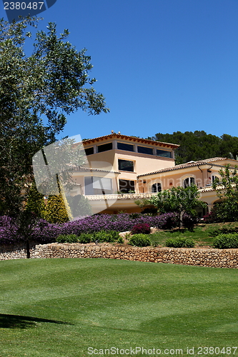 Image of Manicured lawns below a clubhouse