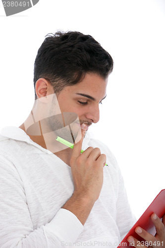 Image of Thoughtful man reading from a clipboard