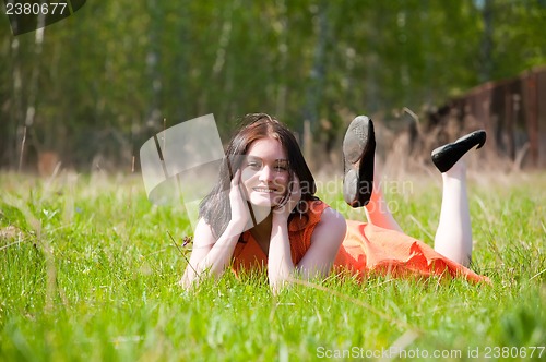 Image of Pretty girl laying on grass