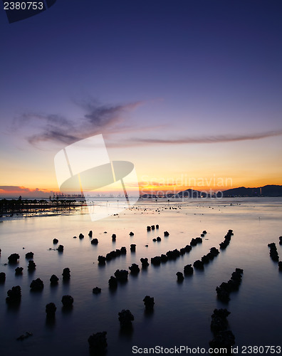 Image of Sunset with sea and stone