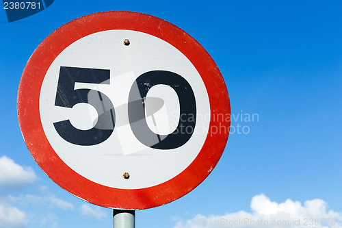 Image of Road sign blue sky background