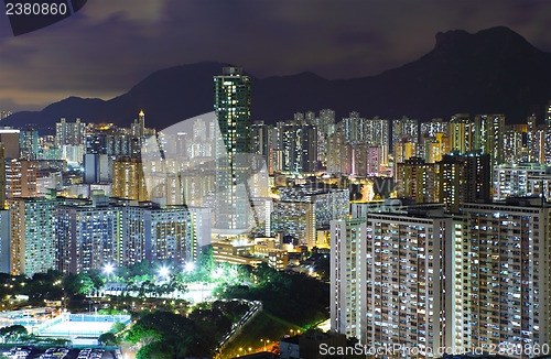 Image of Kowloon area in Hong Kong at night with lion rock