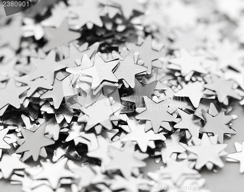 Image of Scattered glittering stars confetti close up