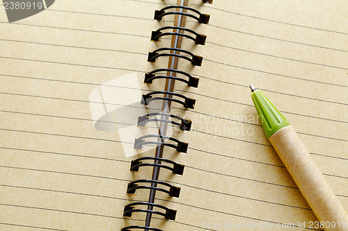 Image of Spiral notebook and pen