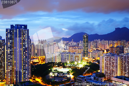 Image of Kowloon side in Hong Kong at night with lion rock
