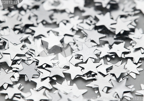 Image of Scattered glittering stars confetti in silver color