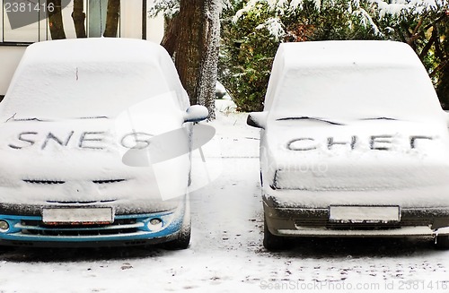 Image of Snow letters written on cars