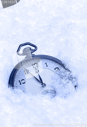 Image of Pocket watch in snow, Happy New Year greeting card