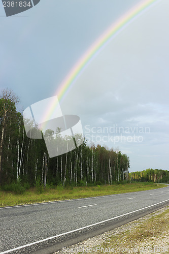 Image of Rainbow over highway in the summer