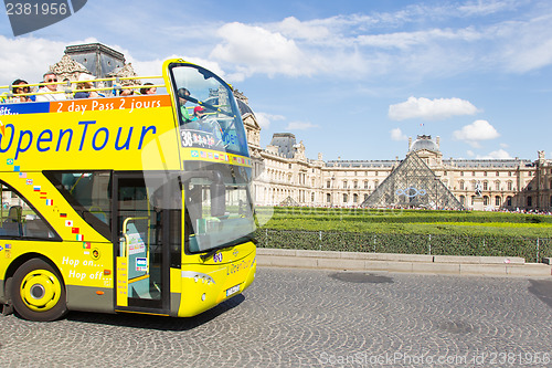 Image of PARIS - JULY 28, 2013. Excursion bus at the Louvre on July 28, 2