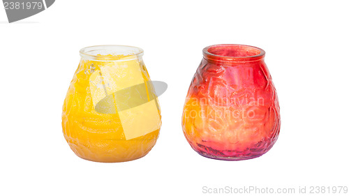 Image of Red and yellow candle in glass