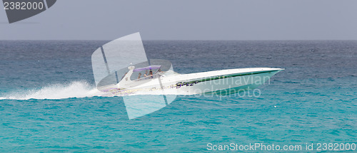 Image of ST MARTIN - ANTILLES, JULY 19, 2013 - Speedboat with tourist on 