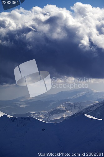 Image of Snow mountains and storm clouds