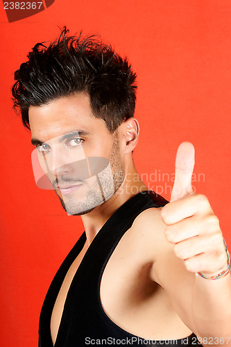 Image of Attractive man with thumbs up