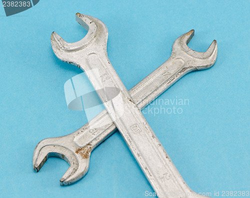 Image of different size screw spanners wrench tools on blue 