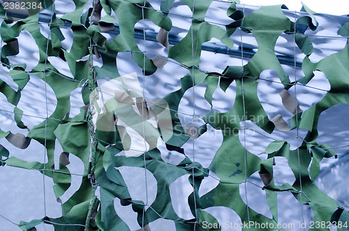 Image of background camouflage army tent fabric holes 