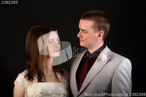 Image of bride and groom on a black background