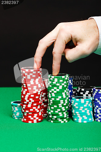 Image of fingers, walking on a chips
