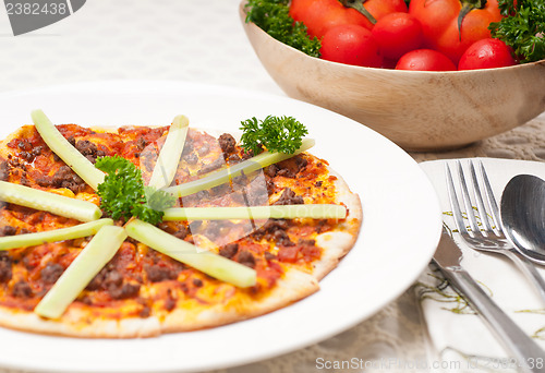 Image of Turkish beef pizza with cucumber on top