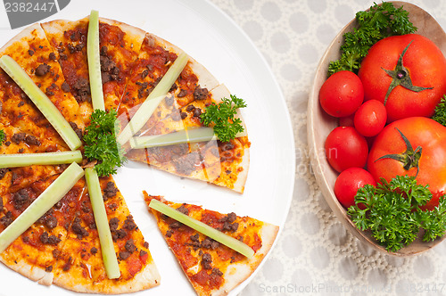 Image of Turkish beef pizza with cucumber on top