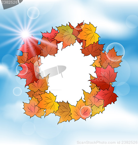 Image of Autumn card with leaves maple on blue sky