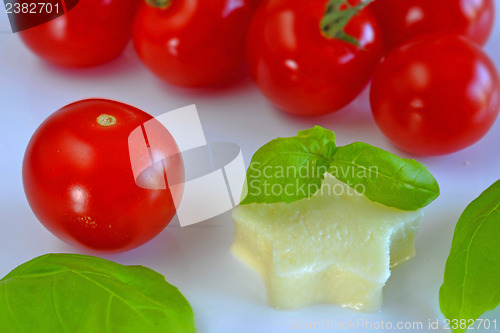 Image of Italian apppetizer tomatoes with mozarella and basil