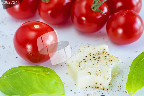 Image of Italian apppetizer tomatoes with mozarella and basil