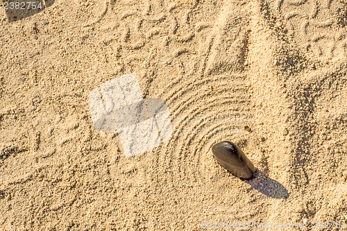 Image of Zen stone in car tracks