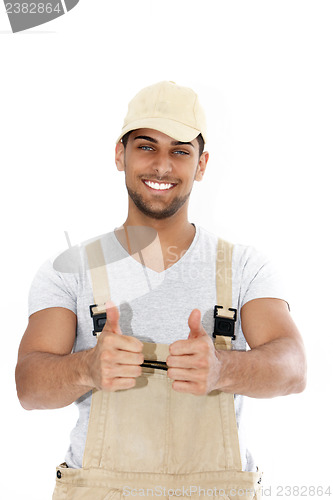 Image of Handsome handyman giving a thumbs up