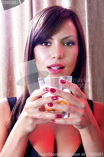 Image of girl with glass of whisky