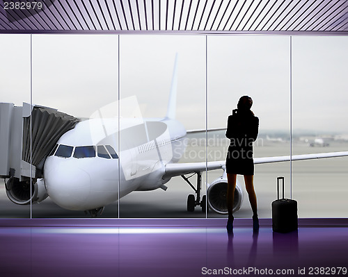 Image of Silhouette of woman at the airport