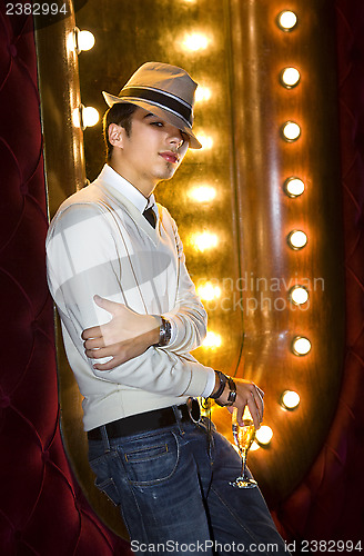 Image of young man with glass of champagne