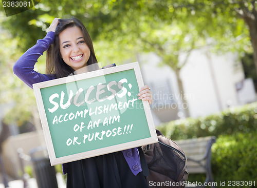 Image of Mixed Race Female Student Holding Chalkboard With Success and De