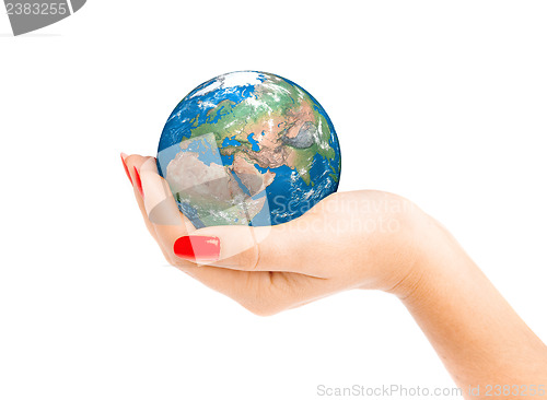 Image of Hand of the person holds globe.