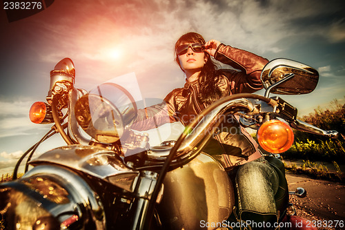 Image of Biker girl on a motorcycle