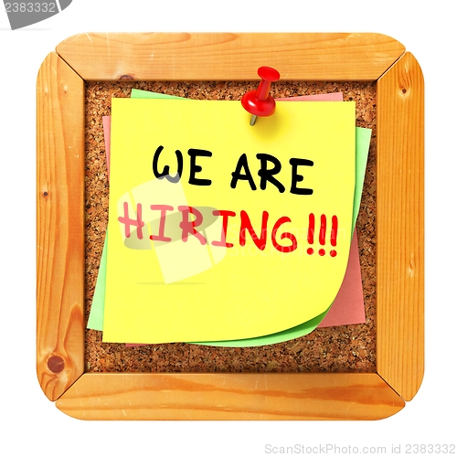 Image of We are Hiring. Yellow Sticker on Bulletin.