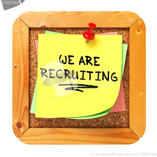 Image of We are Recruiting. Yellow Sticker on Bulletin.