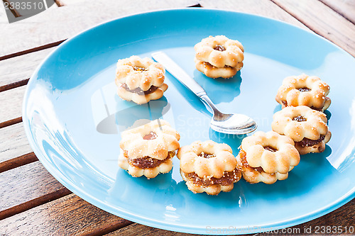 Image of Smiling face of pineapple biscuits on wood table